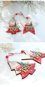 Detail of wooden Christmas ornaments with glitter XMAS text and red beaded strings
