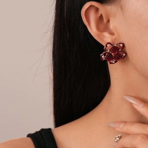 French vintage dark red rose stud earrings with pearls on model in close-up view