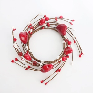 Detailed top view of a red heart berry candle ring wreath for table decoration