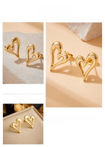 Detail of gold hollow heart earrings featuring liquid metal texture and asymmetric design