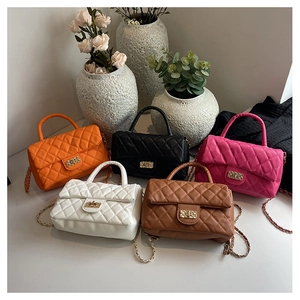Group shot of diamond quilted chain bags in five vibrant colors with metal locks