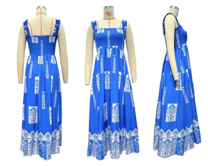 Detail of blue and white floral printed smocked bodice on bohemian maxi beach dress