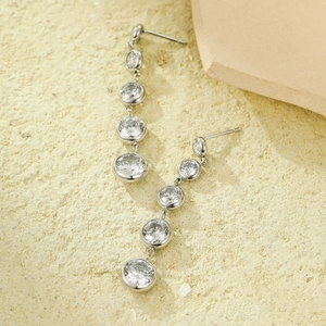 Elegant long silver tassel earrings featuring five graduated round cubic zirconia stones
