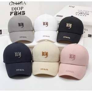 Close-up of lightweight baseball caps with NY embroidery in six assorted colors