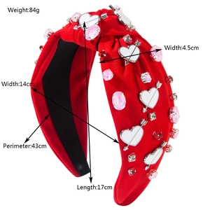 Red knotted headband with rhinestones and heart charms including product dimensions