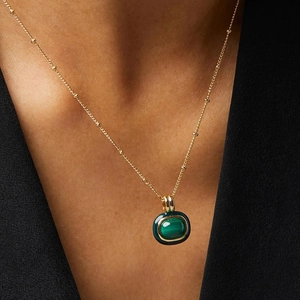 Elegant 18k gold plated necklace featuring a natural malachite pendant on a gold bead chain