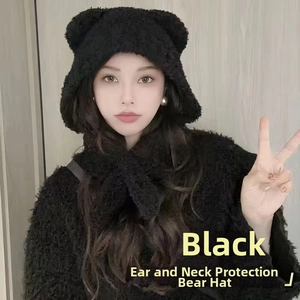 Detailed texture of black plush bear ear scarf hat featuring soft faux fur material