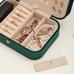 Deep green velvet jewelry box with mirror and pink multi-layered storage compartments