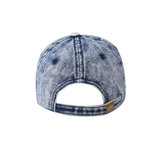 Rear view of washed denim baseball cap featuring an adjustable antique bronze metal buckle
