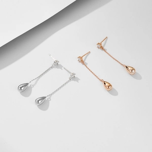 Minimalist long teardrop tassel earrings in silver and rose gold with zircon stones