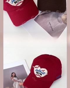 Detailed embroidery of Heart Softball MOM on vintage distressed baseball caps