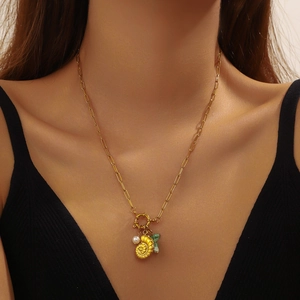 Gold stainless steel paperclip necklace with green beads and ammonite shell pendant