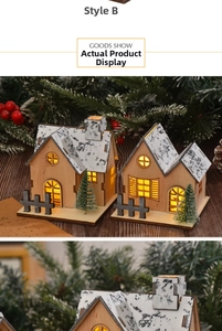 Detail of wooden Christmas LED house ornament with snow roof and warm glowing windows