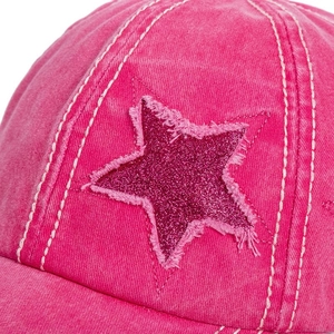Detail of rose red washed denim baseball cap with glitter star patch and white stitching