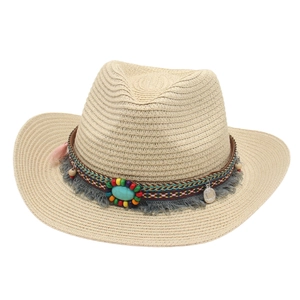 Straw cowboy hat with turquoise stone and bohemian tassels on natural beige weave