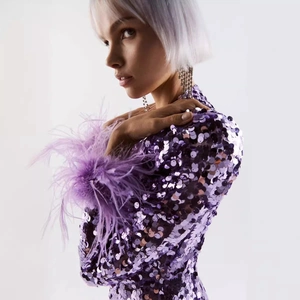 Purple sequin bodycon maxi dress with ostrich feather cuffs shown on a fashion model