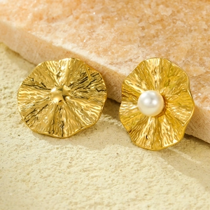 Golden irregular wavy stainless steel stud earrings with white pearl detail