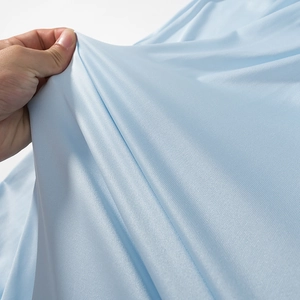 Close-up of light blue bohemian fabric showing soft texture and breathable mesh detail