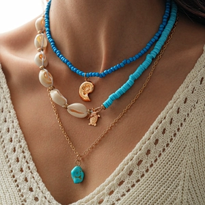 Three-piece bohemian necklace set with blue beads, sea turtle and conch pendants