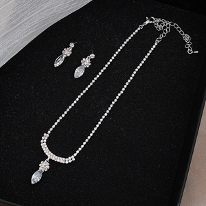 Sparkling silver necklace and earrings set with marquise crystals for wedding jewelry