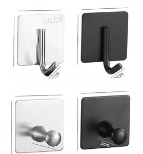 Detailed view of 304 stainless steel adhesive hooks in silver and matte black finishes