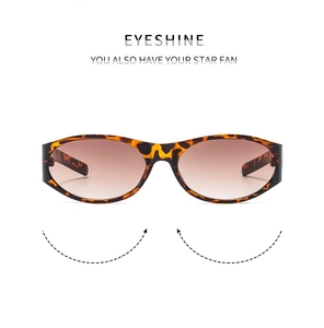 Detail of tortoise shell oval sunglasses frame with high-quality gradient brown lenses
