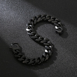 Macro shot of matte black stainless steel curb chain bracelet with lobster clasp