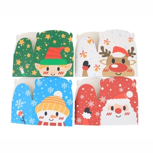 Set of four colorful Christmas candy boxes with reindeer and Santa Claus designs
