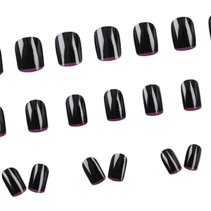 Glossy black press-on nails with purple French tips in a full set on white background