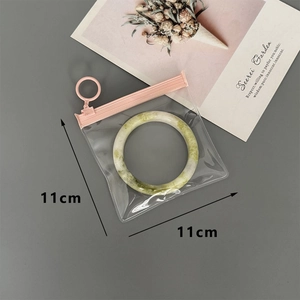 Detail of 11x11cm thickened EVA jewelry storage bag with pink zipper and round puller