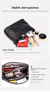 Detail view of the multi-layer interior and large capacity space in the black leather bag