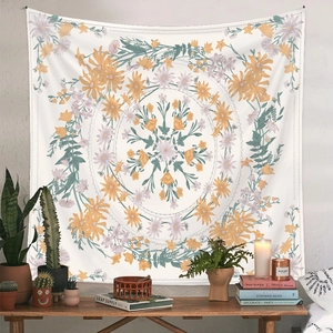 Detail of bohemian mandala tapestry featuring colorful floral patterns on white fabric