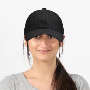 Classic black six-panel baseball cap worn by model, featuring curved brim and cotton fabric