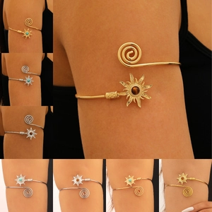 Retro boho sun arm cuff with turquoise stone and adjustable spiral metal band