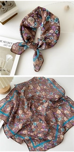 Detail of vintage floral cotton linen square scarf showing smooth texture and hemmed edges