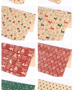 Detail showing six assorted Christmas kraft paper gift bags with reindeer and snowflake patterns