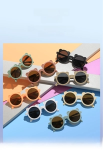 Close-up of cute bear-eared frames on colorful matte kids sunglasses in multiple colors