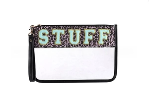 Detail of waterproof clear PVC toiletry bag with purple leopard trim and STUFF chenille patch