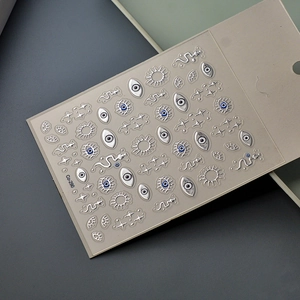 5D embossed nail stickers featuring silver four-pointed stars, angel eyes and snakes