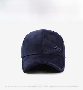 Front view of navy corduroy baseball cap with mountain embroidery and sport lettering