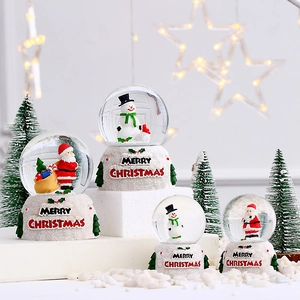 Luminous Christmas snow globes with Santa Claus and Snowman figures on white bases