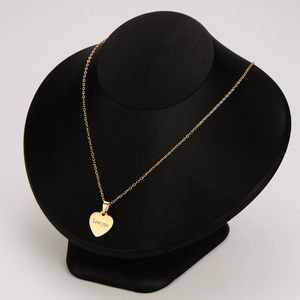Elegant 18k gold plated heart pendant necklace with Love You engraving on a black bust