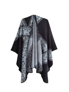 Close-up of black and grey floral jacquard knit pattern on winter shawl wrap