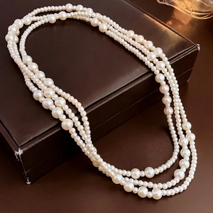 Elegant multi-layered pearl necklace with graduated white pearls for vintage styling