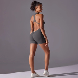 Detail of grey athletic bodysuit featuring a racerback design and high-elastic fabric