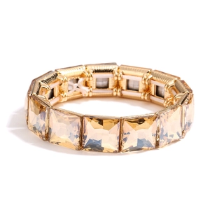 Fashionable stretch bracelet with geometric champagne crystals on a gold-tone alloy base