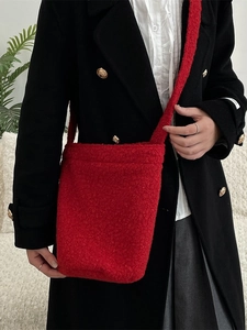 Winter plush red bucket bag in soft fleece with high capacity for casual shoulder use