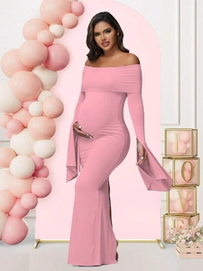 Detail of pink off-shoulder maternity dress with flare sleeves and side slit design