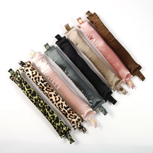 Set of eight heatless hair curlers in assorted silk leopard patterns and solid colors