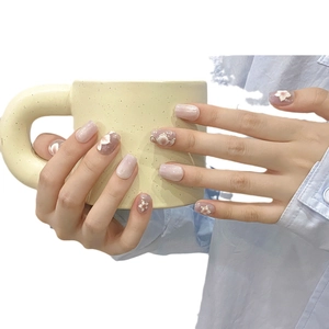 Handmade short press-on nails in purple and pink with 3D floral accents and gold foil